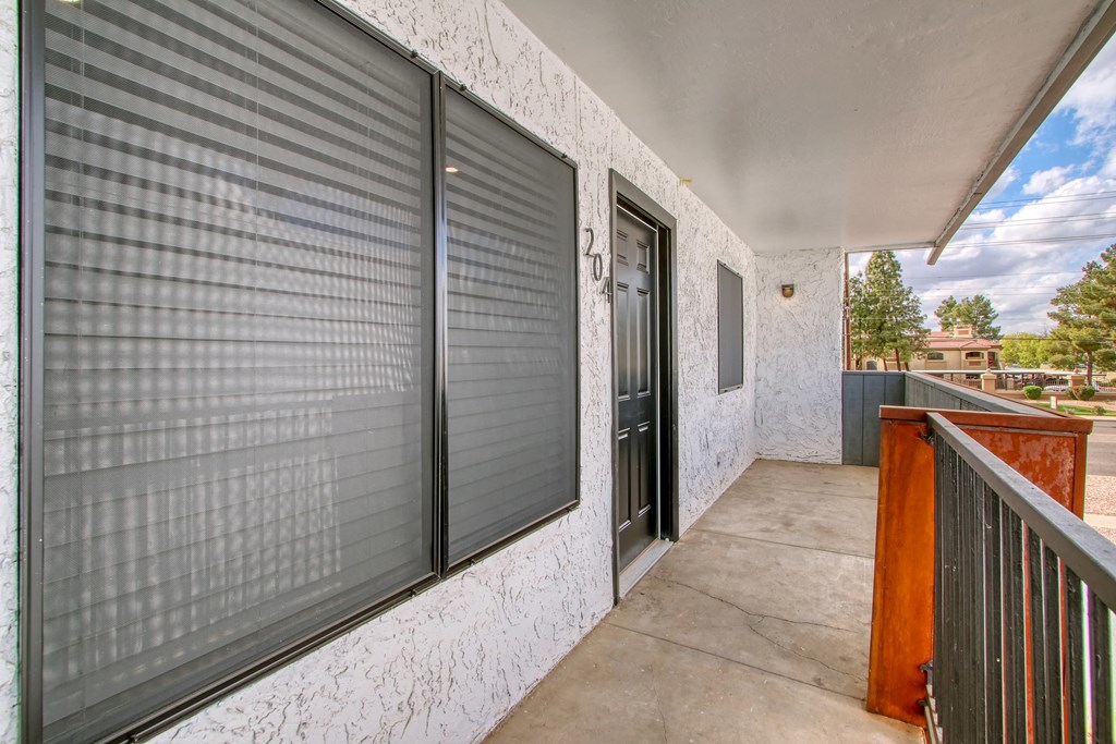 two closets on the side of a building with doors