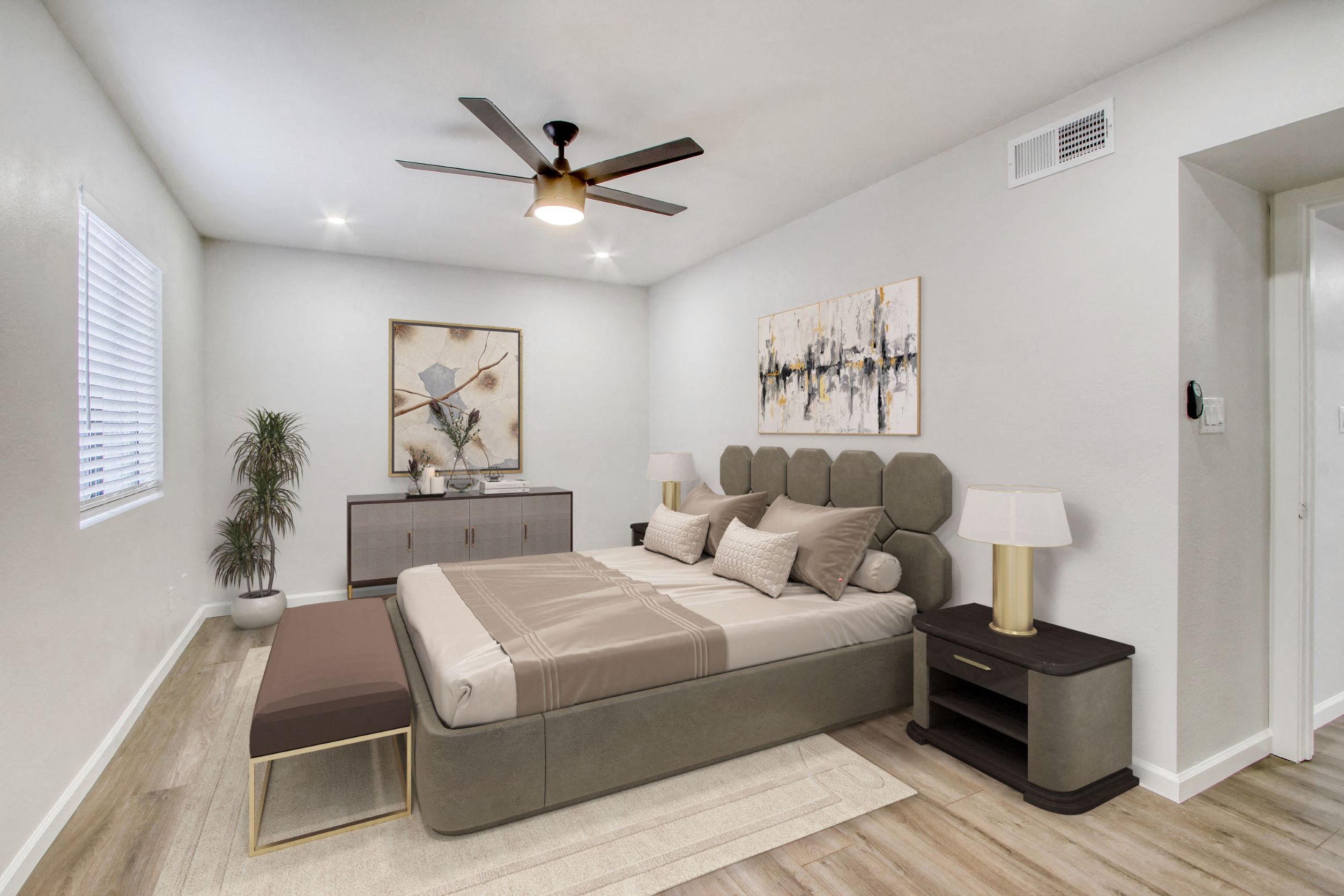 a bedroom with a bed and a ceiling fan