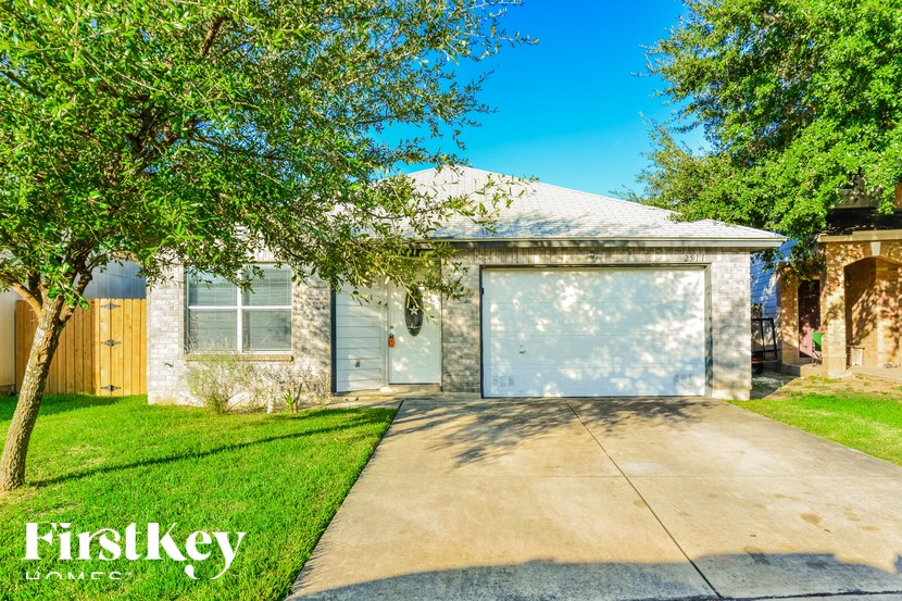 A house with a garage door is for sale by Firstkey Homes.