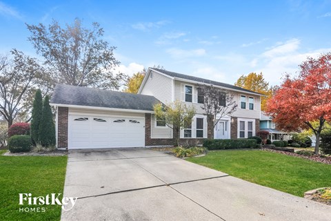 A house with a garage is for sale by FirstKey Homes.