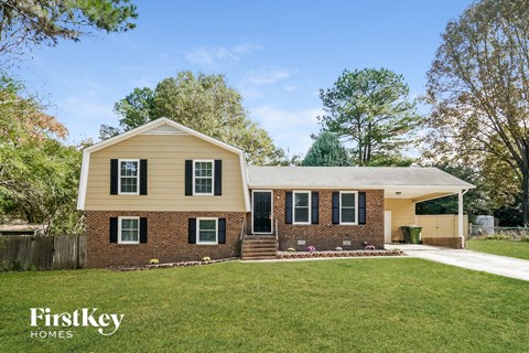 A house with a lawn in front of it.