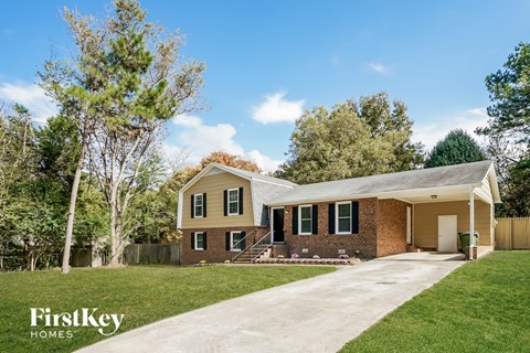 A house with a driveway in front of it.