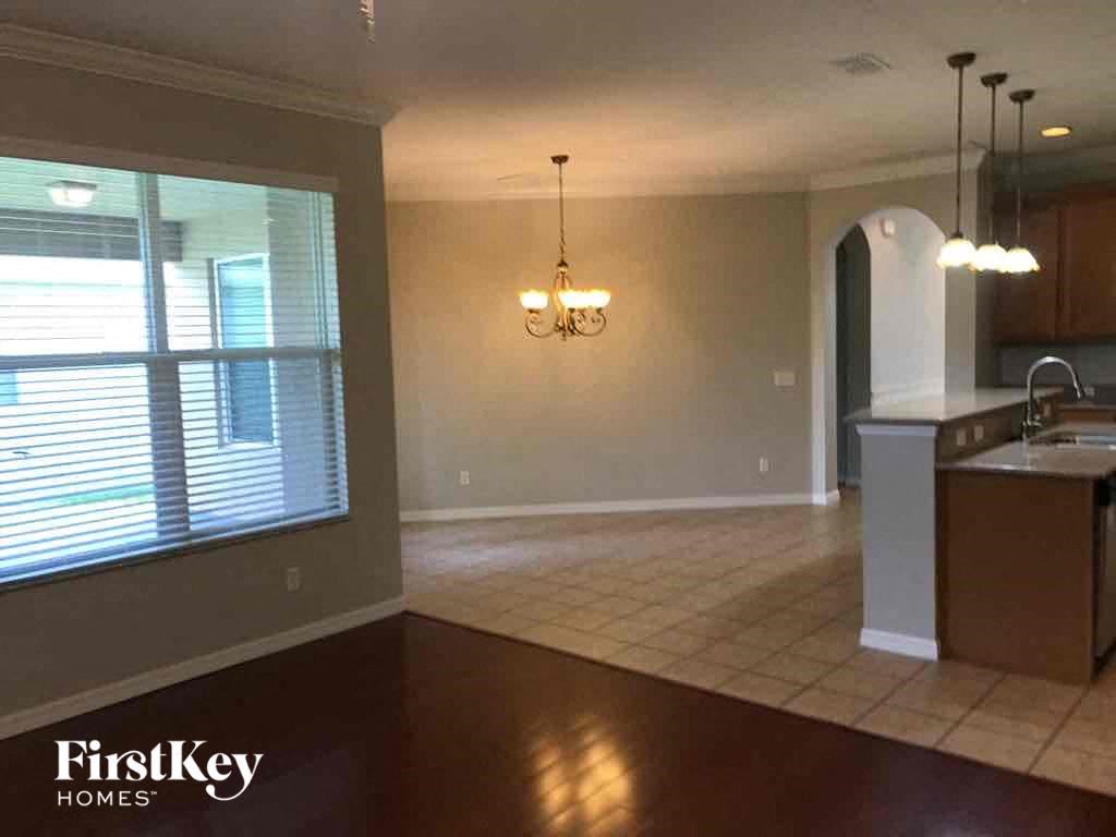 A kitchen area with a counter and a sink.