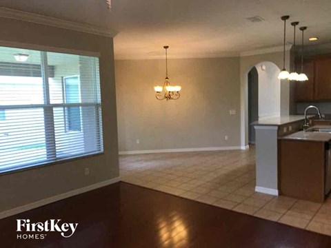 A kitchen area with a counter and a sink.