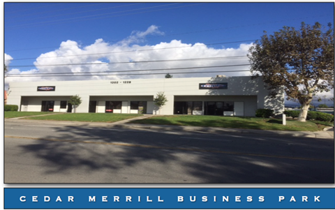 Cedar Merrill Business Park is a large, modern building with a parking lot in front.