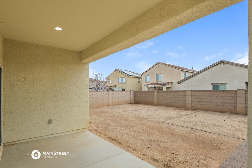 a view of the backyard from the patio of a new home