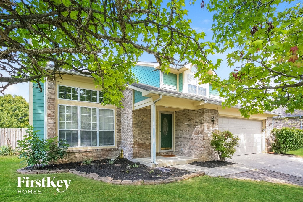 a house with a tree in front of it