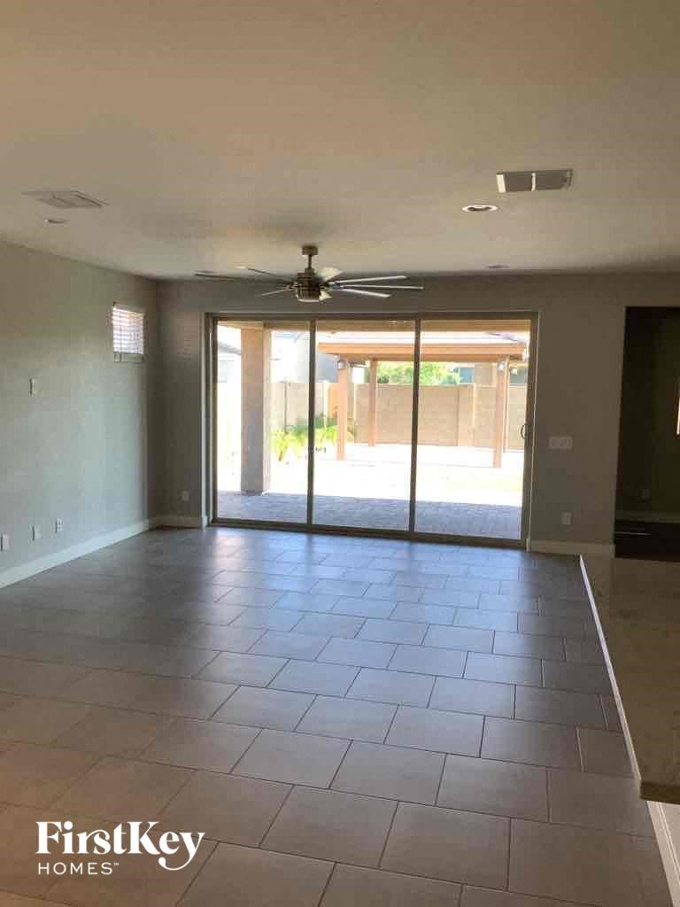 A room with a sliding glass door leading outside.