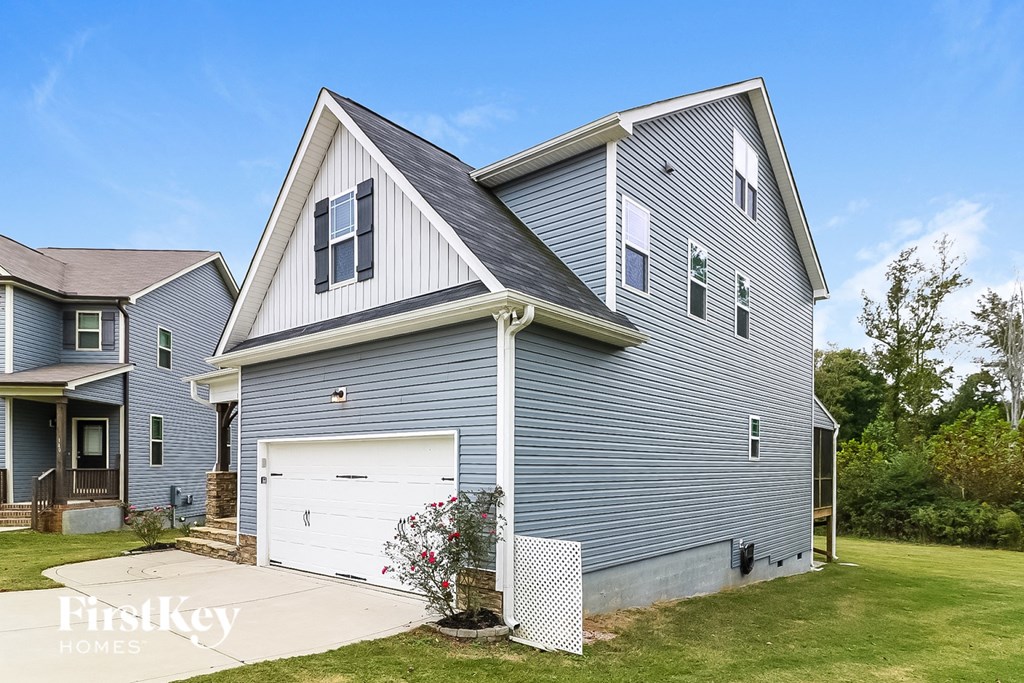 a blue house with a white garage door