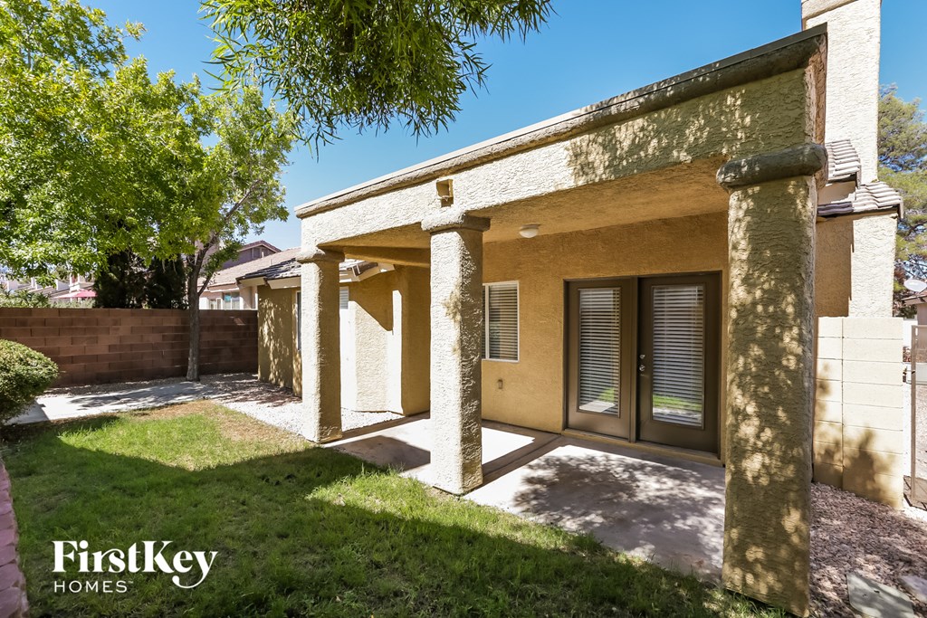 A house with a brown and beige exterior is for sale.