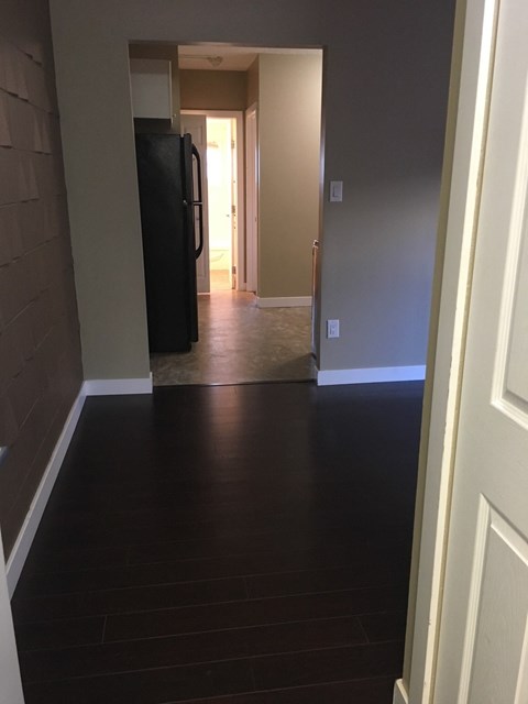 a view of the living room from the hallway of a house