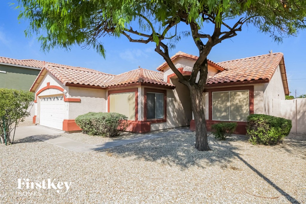 a house with a tree in front of it