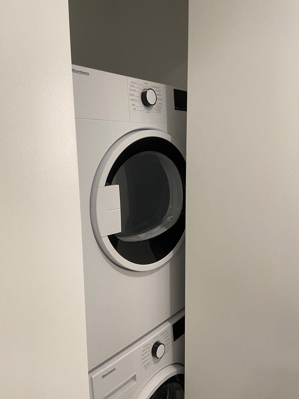 a washing machine and dryer in a laundry room