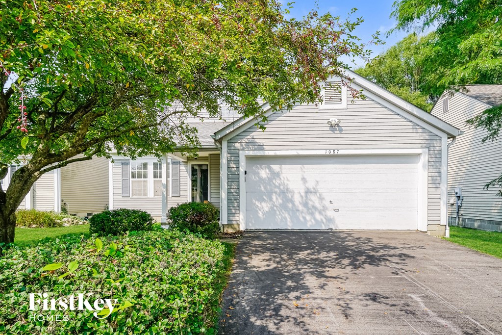a white house with a white garage door