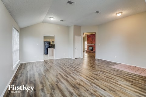 the living room and dining room are open to the kitchen and living room