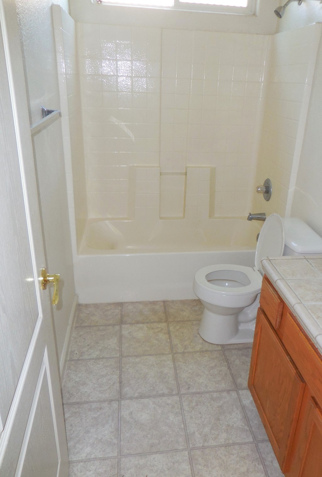 a small bathroom with a toilet and a shower