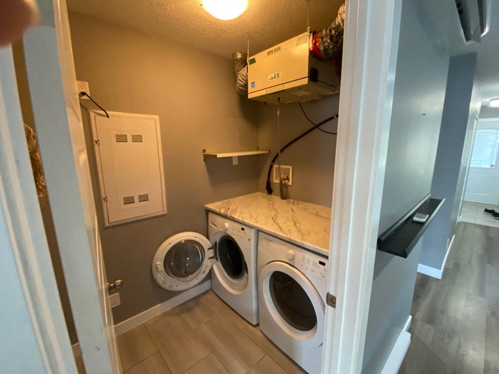 a laundry room with a washer and a dryer