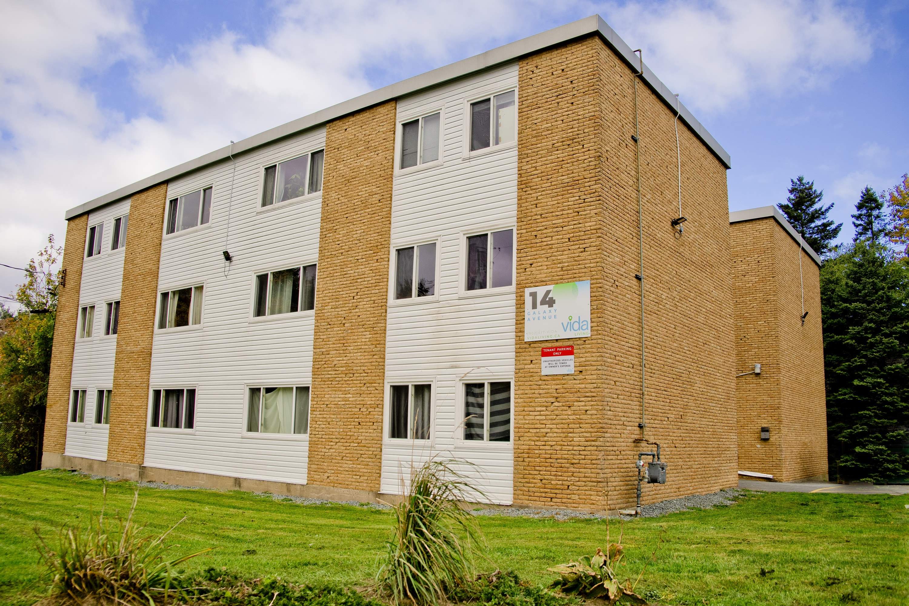 A brick building with a sign that says "14 video".