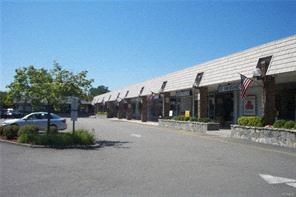 a parking lot with a car parked in front of a building