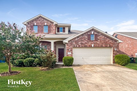 a house with a driveway and a garage door