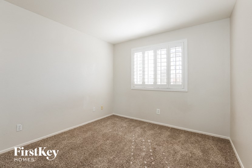 a room with carpet and a window