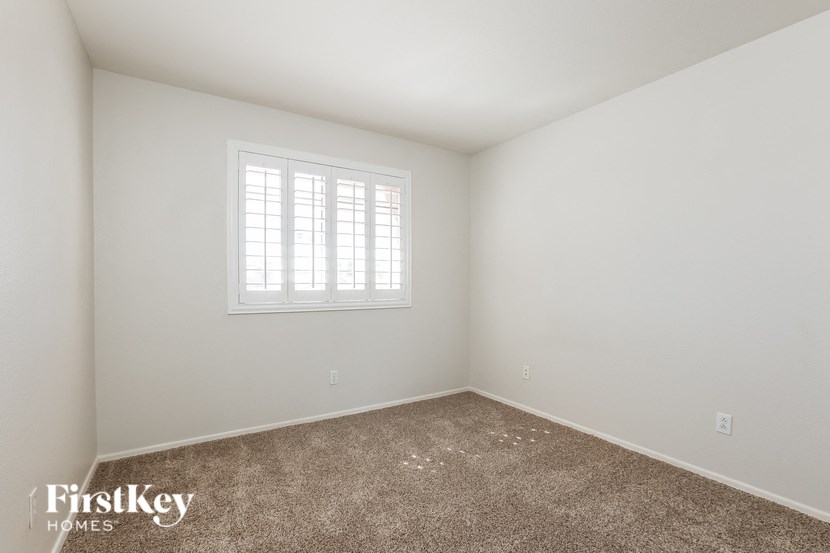 a room with carpet and a window