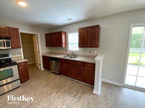 a kitchen with a stove and a sink