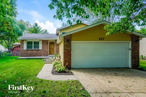 a brick house with a white garage door
