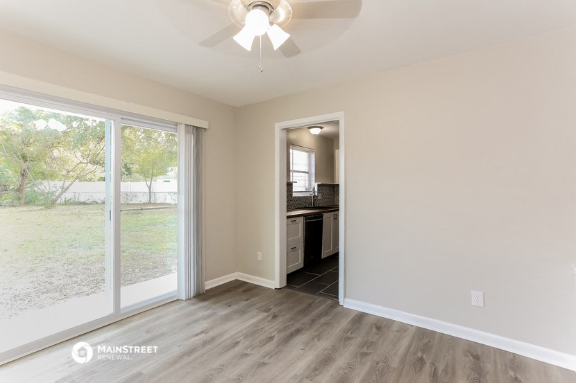the living room and kitchen of a new home