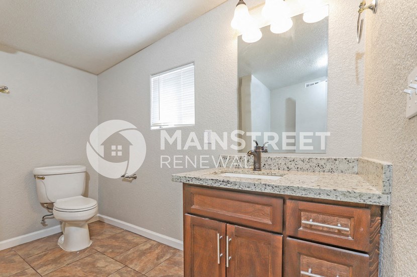 a bathroom with a sink and a toilet