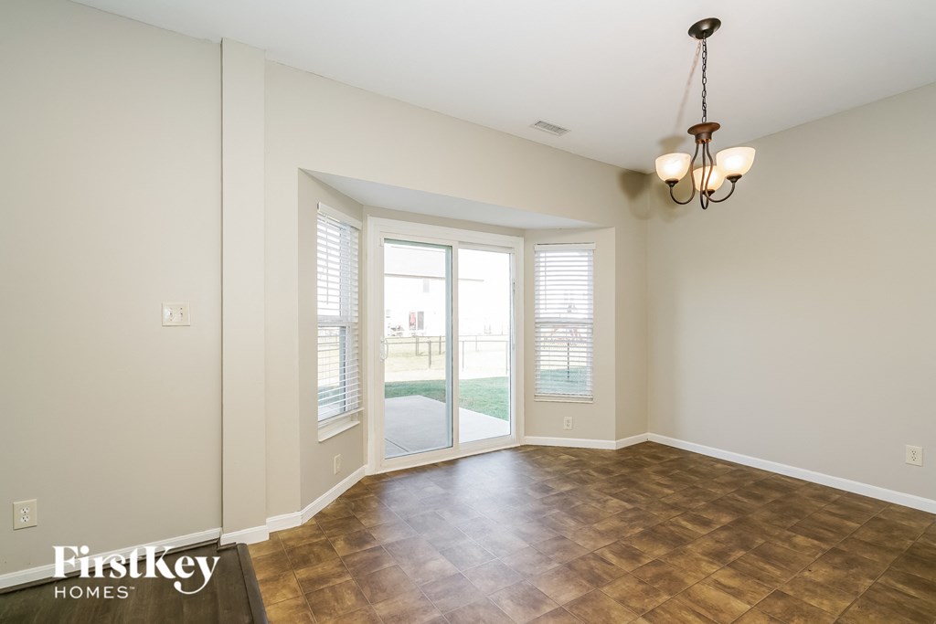 a living room with a window and a door to a patio