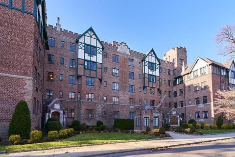 a large brick apartment building on a city street