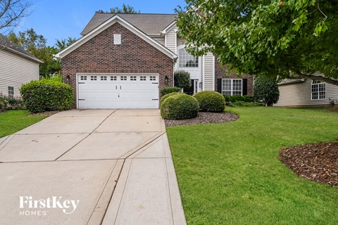 a white garage door in front of a house