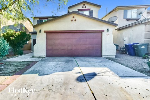 a garage with a brown garage door in front of a house