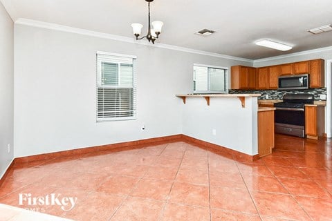a kitchen with a counter top and a stove and a sink