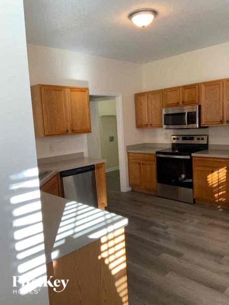 a kitchen with wooden cabinets and a counter top