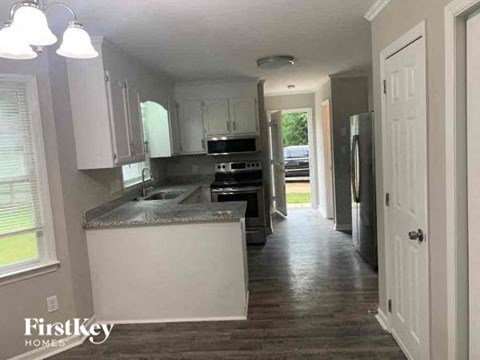 a kitchen with a counter top and a refrigerator