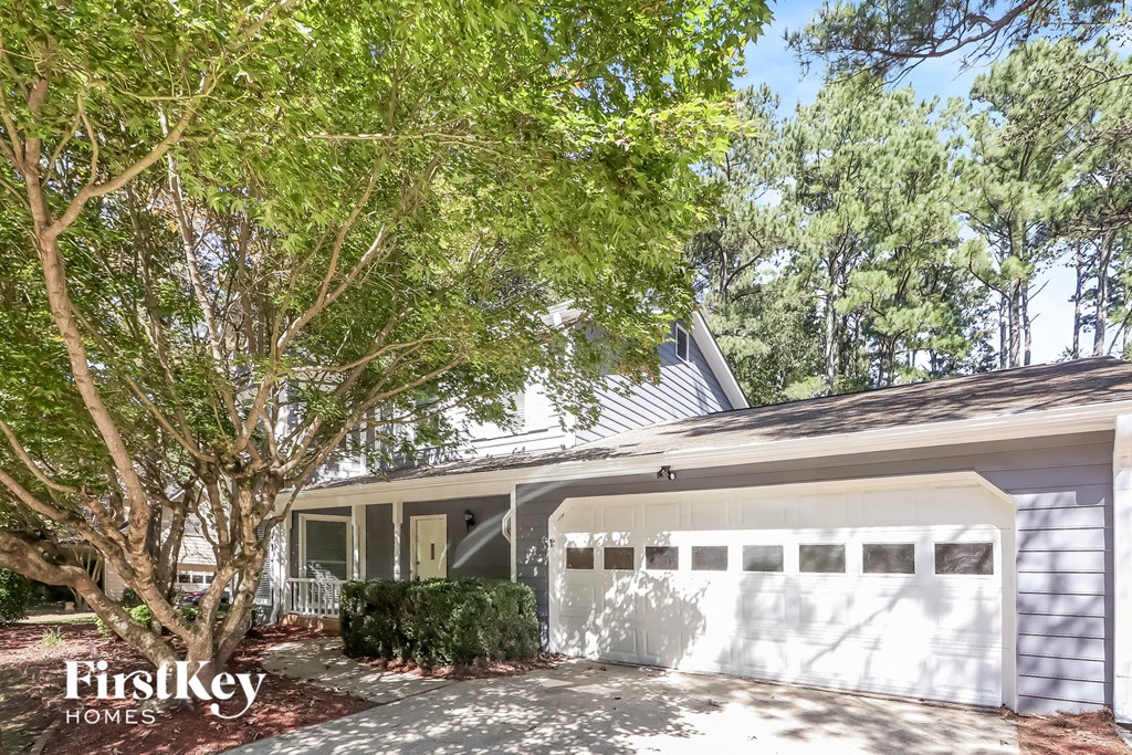 A white garage with a FirstKey Homes logo.