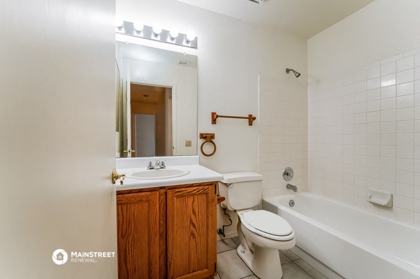 a bathroom with a sink toilet and a bath tub