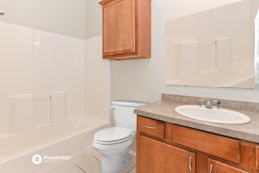 a bathroom with a sink toilet and a shower