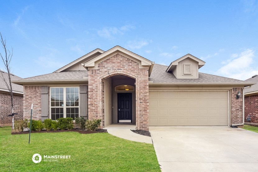 a house with a driveway and a garage door