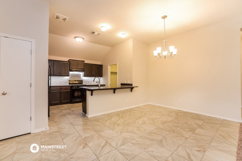 the kitchen and living room are spacious and open to the living room and dining room