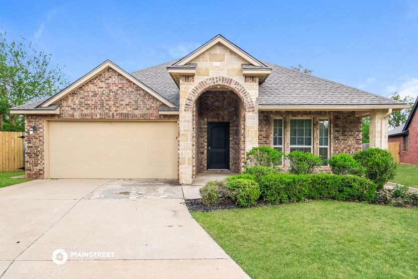 a house with a driveway and a garage door