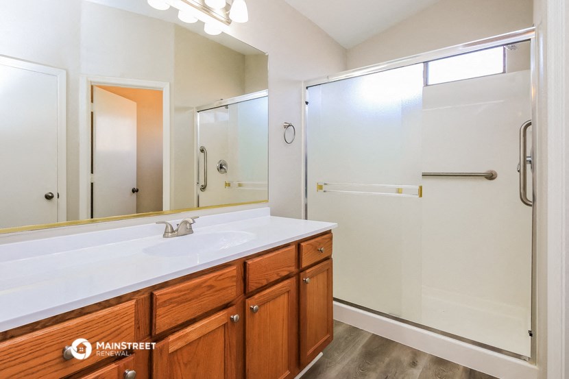 a bathroom with a sink and a shower