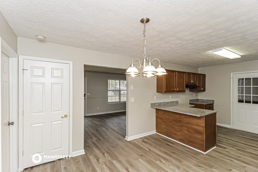 the kitchen and living room of an open floor plan