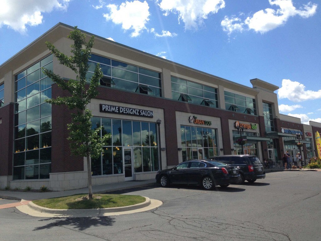 a building with cars parked in front of it