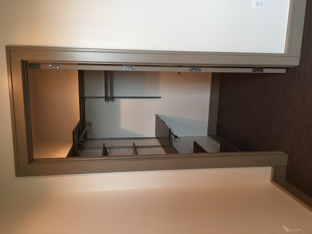 a view of the inside of a room from the bottom of a glass window