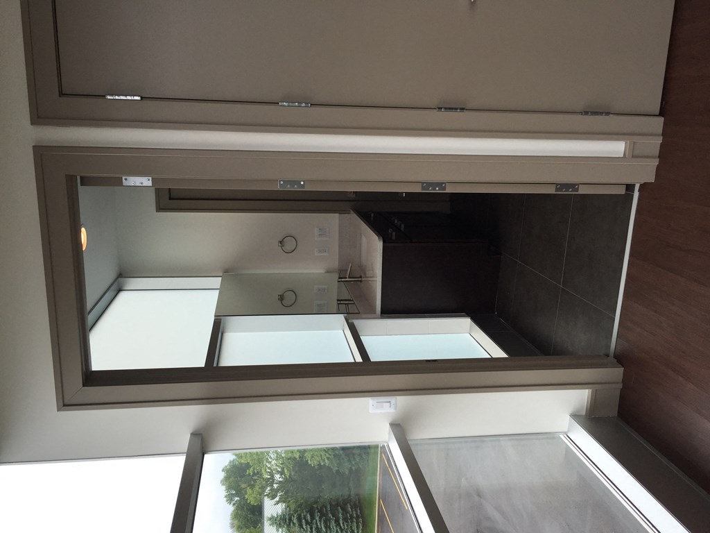 a view from the bottom of a glass window into a kitchen