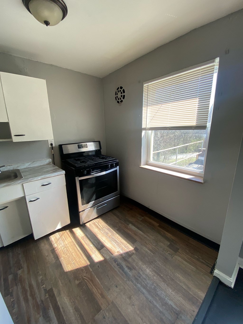 A kitchen with a stove top oven and a dishwasher.