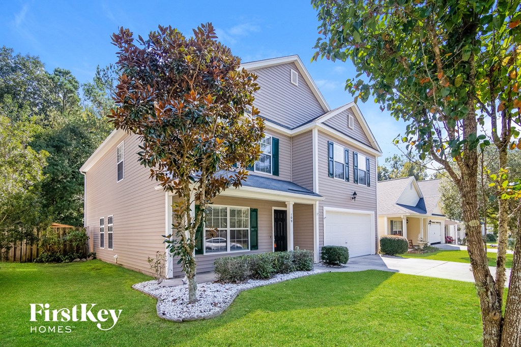 A house with a tree in front of it.